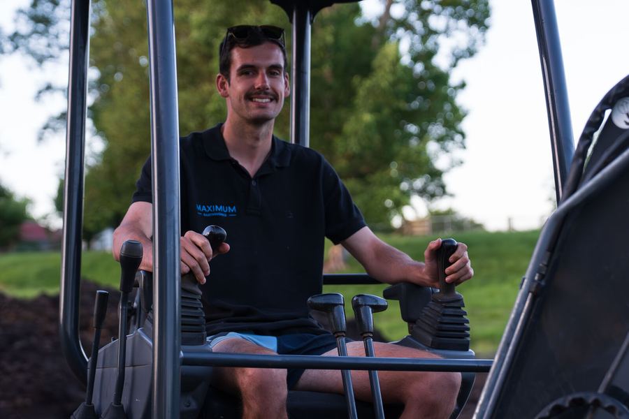 Max Arnel in the cab of the Maximum Earthworks excavator