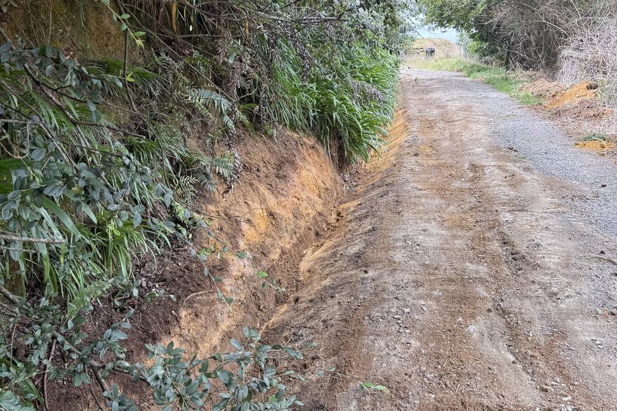 Rural driveway cut into a bank