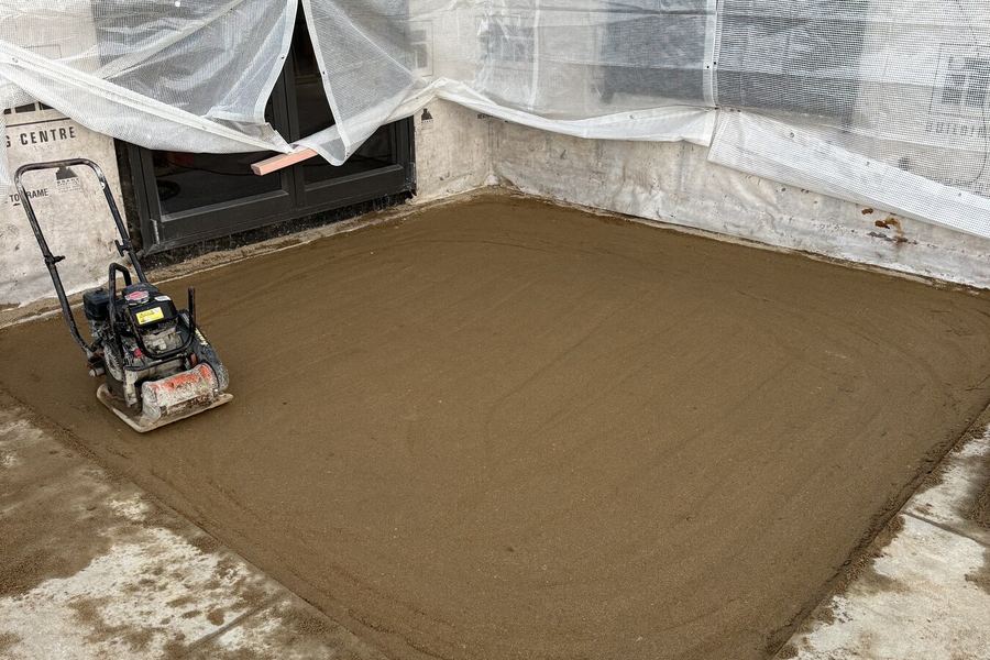 Compacted sand pad under a new build
